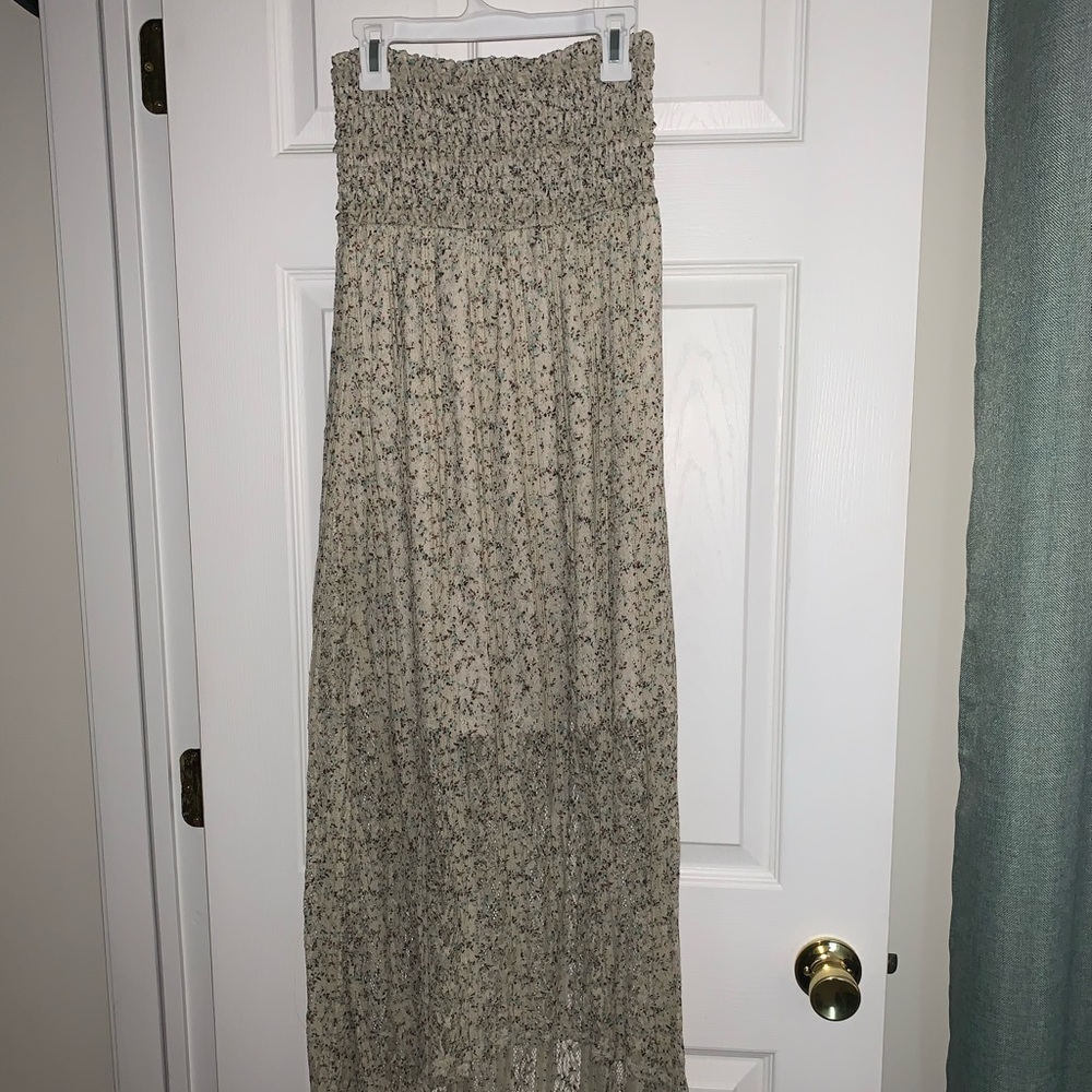 Macy’s strapless beige dress.